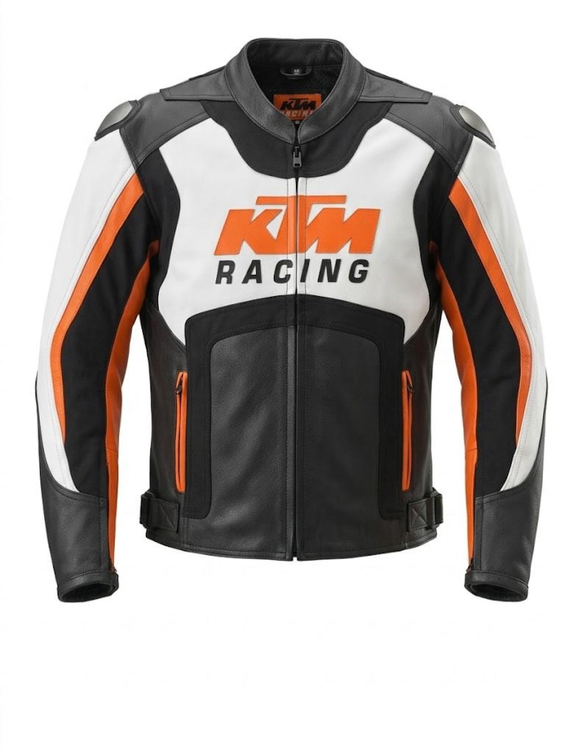 May include: A black, white, and orange motorcycle jacket with the KTM Racing logo. The jacket has a full-length zipper, a stand-up collar, and padded shoulders. The sleeves have orange and white stripes. The jacket is made of leather.