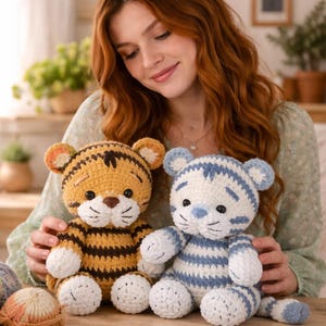 May include: A white ceramic mug with a black handle and the text "But First, Coffee" in a black, handwritten-style font. The mug is on a white surface.