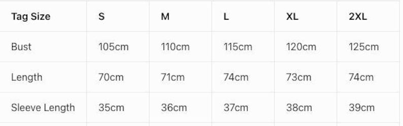 May include: A clothing size chart displaying measurements in centimetres. It details bust, length, and sleeve length for sizes S, M, L, XL, and 2XL. Bust measurements range from 105cm to 125cm, providing a guide for garment sizing.