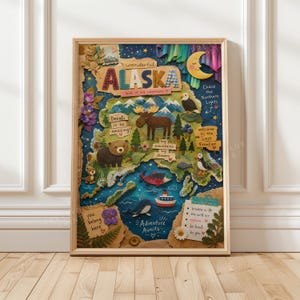 May include: A framed wall art print featuring a map of Alaska with collage-style illustrations of a moose, bear, puffin, eagle, whale, and boat. The text includes 'wonderful ALASKA', 'Denali is so amazing', 'Chase the Northern Lights', and 'Adventure Awaits'.