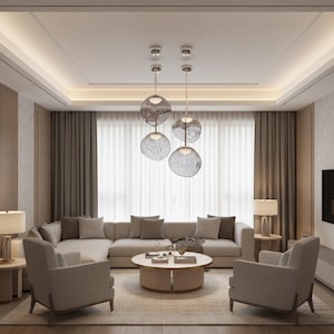 May include: A modern living room with neutral tones. Features a large sectional sofa, two armchairs, and a round coffee table. Overhead, four glass globe pendant lights hang from the ceiling. The room is decorated with curtains and lamps.