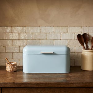 May include: A handmade wooden sign with the text "Welcome" in a handwritten style. The sign is painted white with a distressed finish, and a small green leaf is attached to the top. The sign is designed for indoor or outdoor use.