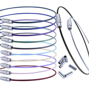 May include: A set of ten colorful, adjustable, stainless steel cable bracelets with silver end caps. The bracelets are stacked in a pile, with a few extra end caps scattered on the table.