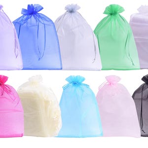 May include: A collection of ten sheer organza drawstring gift bags in various colors including lavender, blue, white, green, pink, light blue, and black. Each bag features a matching ribbon drawstring closure at the top for securing contents.