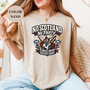 A woman wearing a t-shirt with a graphic design that says "No Scotland No Party Tartan Army".