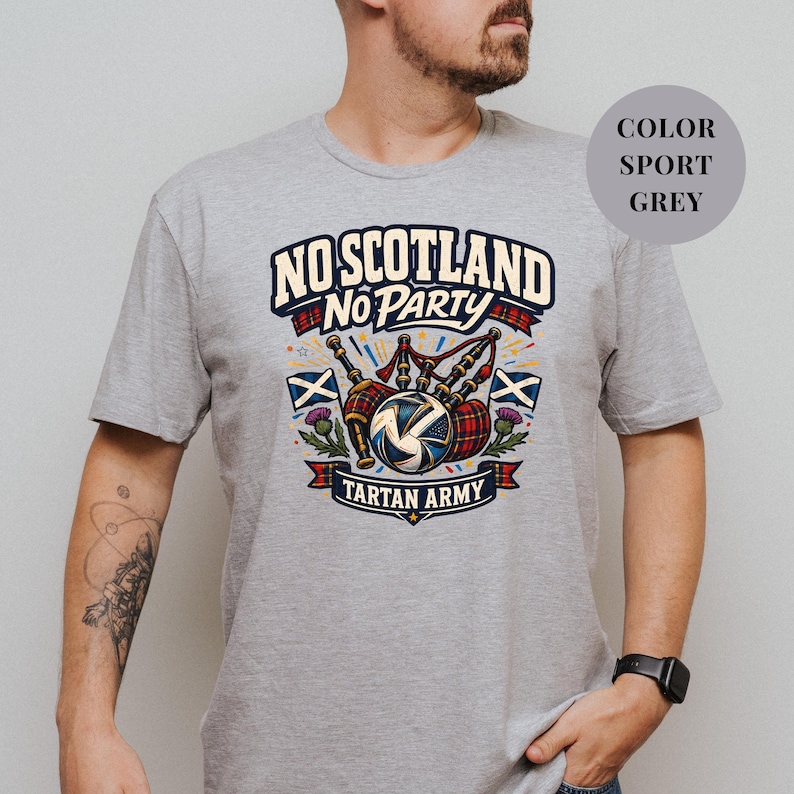 A man wearing a grey t-shirt with a graphic design that says "No Scotland No Party Tartan Army".