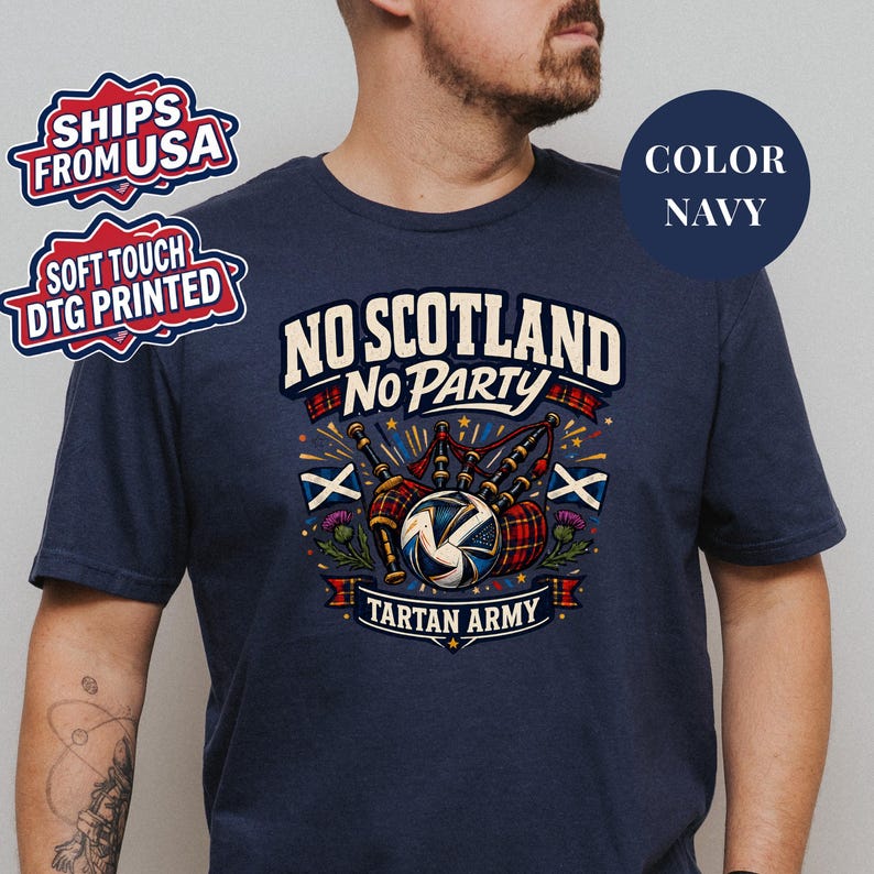 A man wearing a navy blue t-shirt with a graphic design featuring a tartan army and the text "No Scotland No Party" printed on it.