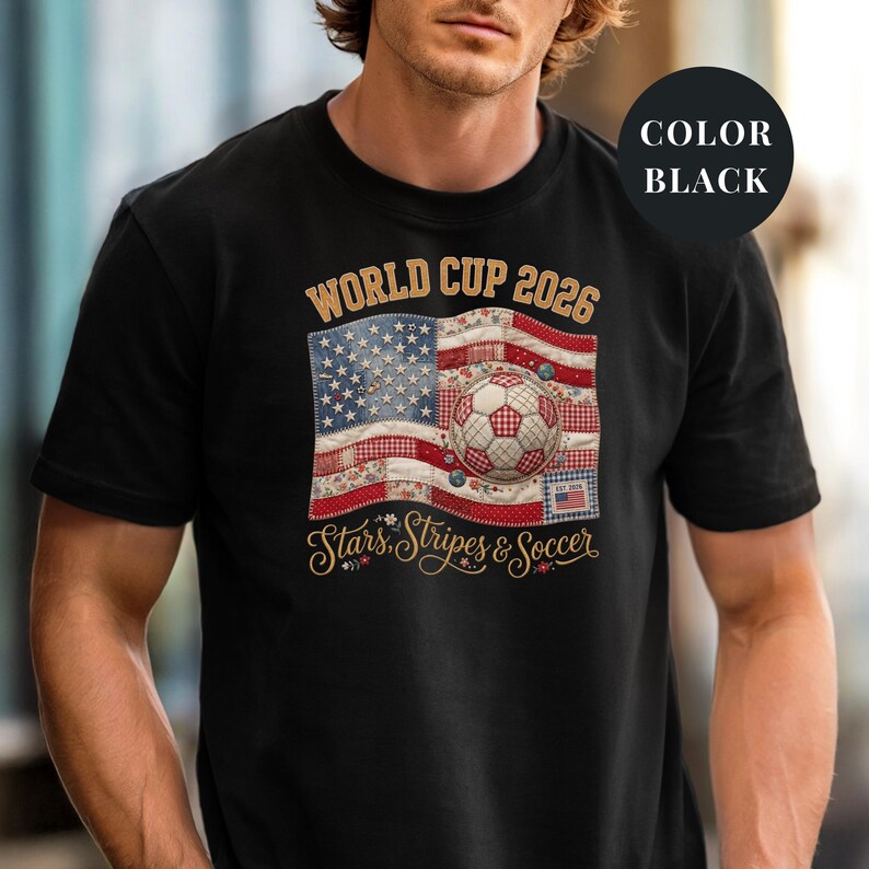 Black colored t-shirt featuring a vintage patchwork American flag design for World Cup 2026. The faux quilted graphic includes floral and gingham fabric textures, a stitched soccer ball, and "Stars, Stripes & Soccer" text. Unique patriotic sports apparel for women and USA soccer fans.