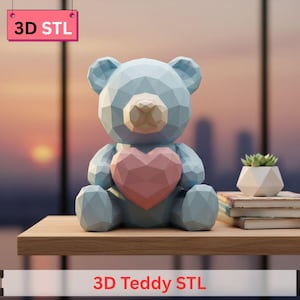 May include: A geometric, light blue teddy bear figurine with a pink heart, sitting on a wooden surface. The bear has a polygonal design. The text "3D STL" is on a pink sign, and "3D Teddy STL" is at the bottom.
