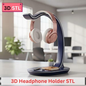 Puede incluir: Un soporte para auriculares azul marino con detalles en blanco y oro rosa, sosteniendo unos auriculares en oro rosa y blanco. El soporte tiene un diseño curvo y una base pequeña. El texto "3D Headphone Holder STL" está presente.