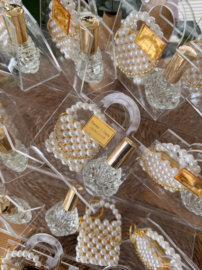 Custom gold mirrored name tag on a luxury plexi purse favor for personalized guest appreciation