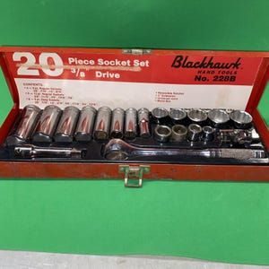 May include: A 20-piece Blackhawk Hand Tools 3/8 inch drive socket set in a red metal case. The set includes various chrome sockets, a reversible ratchet, a 3-inch extension, and a universal joint, with contents listed on the interior lid.