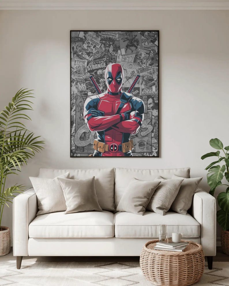 May include: A framed poster featuring the character Deadpool, in a red and black costume, with crossed arms. The background is a collage of comic book panels. The poster is displayed above a white sofa with neutral-colored pillows.