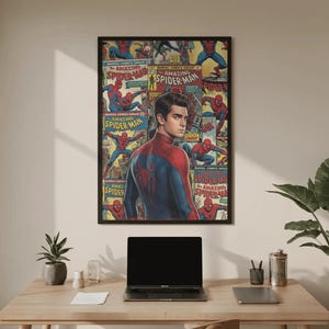 May include: A framed poster with a black border, showcasing a collage of Spider-Man comic book covers and a portrait of the superhero. The poster is displayed on a light-coloured wall. The image includes the text "AMAZING SPIDER-MAN".