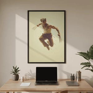 May include: A framed wall art print featuring a leaping figure with metallic claws extending from each hand. The figure wears a white tank top and brown trousers, captured in a dynamic mid-air pose against a light beige background with motion lines.