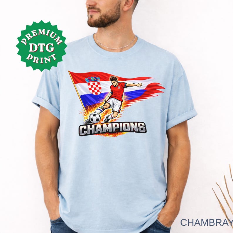 A man wearing a chambary t-shirt with a graphic of a soccer player kicking a ball and the text "CHAMPIONS" printed on it.