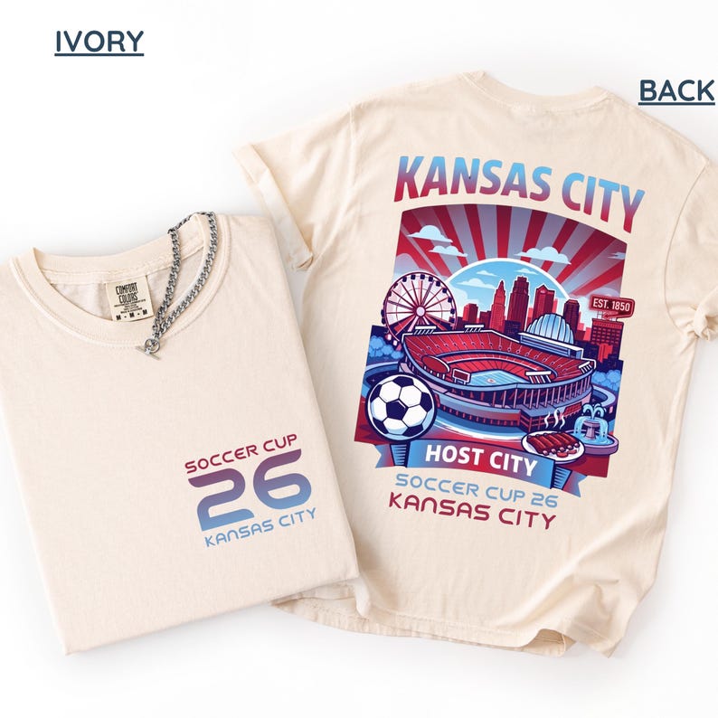 An ıvory back print shirt the front features a minimal "SOCCER CUP 26 KANSAS CITY" logo.