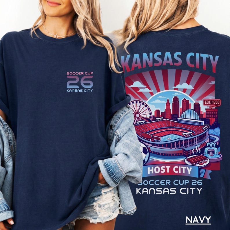 A navy back print shirt the front features a minimal "SOCCER CUP 26 KANSAS CITY" logo.