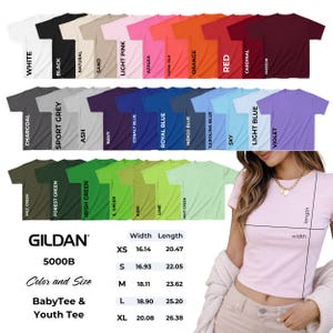 May include: A variety of Gildan 5000B baby tees and youth tees in multiple colors, including white, black, and red. The image also shows size and measurement details in inches for each size, from XS to XL.