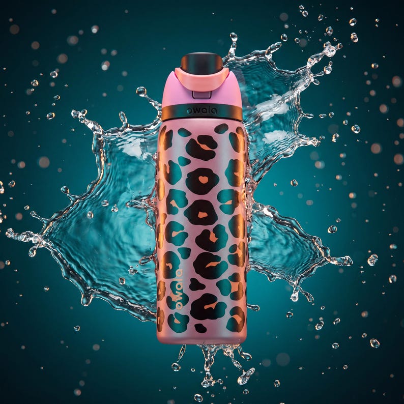 May include: A pink and black leopard print water bottle with a black lid and a pink handle. The bottle is surrounded by water droplets against a teal background. The brand name "owala" is printed on the bottle.