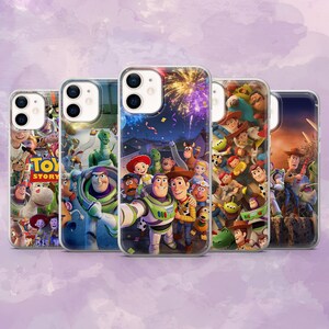 May include: Five clear phone cases featuring colorful graphics of characters from the animated film Toy Story. The cases showcase various scenes with Woody, Buzz Lightyear, and other characters. The cases are designed for a smartphone.