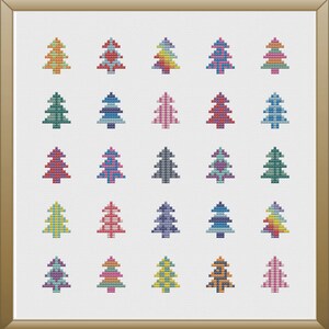 Peut inclure: Une broderie au point de croix encadr&eacute;e repr&eacute;sentant une grille de vingt sapins de No&euml;l color&eacute;s. Chaque arbre pr&eacute;sente une combinaison de couleurs diff&eacute;rente, notamment des nuances de rouge, de vert, de bleu, de jaune et de violet. Les arbres sont sur fond blanc.