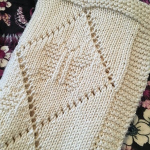 Modello per coperta traforata a farfalla, filato Aran (download PDF)