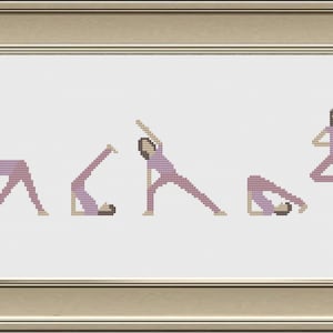 May include: Cross-stitch artwork depicting a sequence of yoga poses in shades of lavender and beige. The framed piece shows five figures in various asanas, including a triangle pose and a tree pose. The artwork is framed in a gold-colored frame.