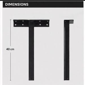May include: Black metal shelf brackets. The brackets are T-shaped, with a horizontal top section and a vertical support. The vertical support is 40 cm (15.7 inches) long. The top section has pre-drilled holes for mounting.