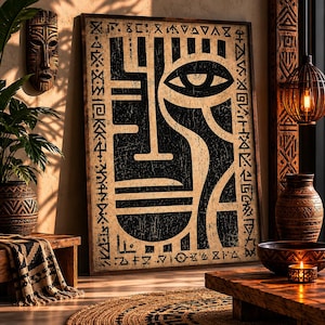 Peut inclure: Une œuvre d'art murale rectangulaire encadrée présentant un motif de visage abstrait noir et beige avec un œil proéminent et des symboles géométriques le long de la bordure. L'œuvre a un aspect texturé et vieilli avec des lignes audacieuses.