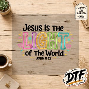 May include: A graphic design featuring the black text Jesus is The LIGHT of The World JOHN 8:12. The word LIGHT is written in large, colorful, neon-style outlined letters in pink, purple, yellow, green, and blue, accented with small stars and hearts.