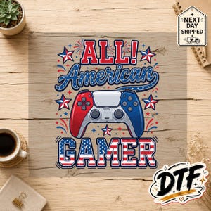 May include: A graphic design featuring the text ALL! American GAMER with a red, white, and blue color scheme. The design includes a video game controller, stars, and fireworks motifs, with the word GAMER filled with a stars and stripes pattern.