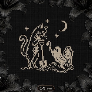 May include: A cross-stitch pattern on a black background featuring a beige cat holding a shovel and a small ghost holding a flower. The design includes a crescent moon and three stars above the figures. The text OXtudio is visible at the bottom.