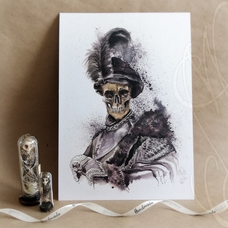 May include: Watercolor painting of a skeleton in a feathered hat and armor. The artwork features a detailed skull and dark, splattered ink effects. Two small glass vials with skeletal figures are in the foreground.
