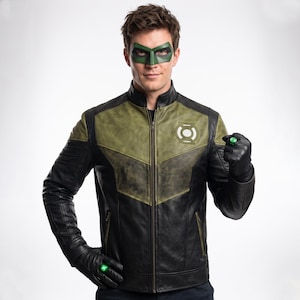 May include: A black and olive green leather jacket featuring a Green Lantern emblem on the chest, a stand-up collar, and a front zip. The outfit includes a green eye mask and black leather gloves, each adorned with a glowing green ring.