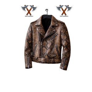 May include: Brown snakeskin-patterned leather jacket with a classic biker style. Features a notched collar, asymmetrical zipper closure, multiple zippered pockets, and a belt at the waist. The jacket is hanging on a black hanger.