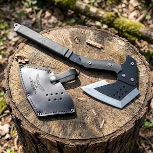 May include: A black metal hatchet with a silver blade edge featuring the engraved text 'Thorns in flight' and a black leather sheath with a silver snap closure, embossed with an owl graphic and the name 'David' above the bird illustration.