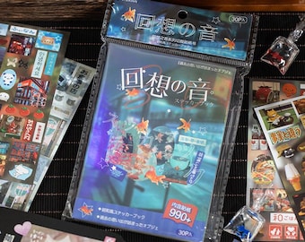 May include: A rectangular sticker book in a clear plastic sleeve with a blue cover featuring goldfish illustrations and Japanese text. The header displays the title in Japanese characters with small star accents and a 30-piece count label.