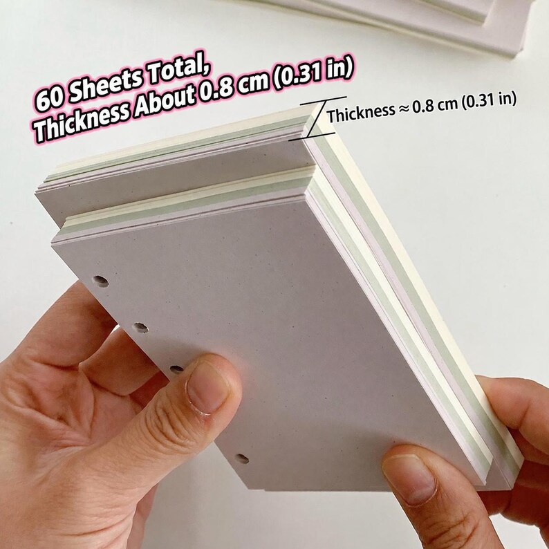 May include: A stack of white paper sheets with pre-punched holes along one side. The stack contains 60 sheets total with a thickness of approximately 0.8 cm (0.31 in). Text on the image reads: 60 Sheets Total, Thickness About 0.8 cm (0.31 in).