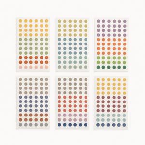 May include: Six rectangular sheets of adhesive stickers, each featuring a grid of small, solid-colored circular dots. The stickers display a wide variety of colors including yellow, green, orange, blue, purple, gray, and pink in various shades.