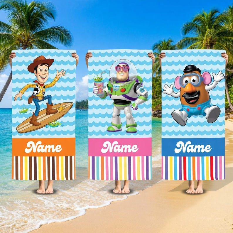 May include: Three beach towels featuring Toy Story characters. Each towel has a blue wave pattern background, a character image, and the word "Name" at the bottom. The towels are held up on a beach with palm trees.