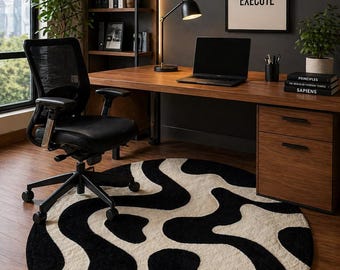 Abstracte getufte vloerkleed in zwart-crème, organisch golvend patroon, moderne minimalistische woondecoratie