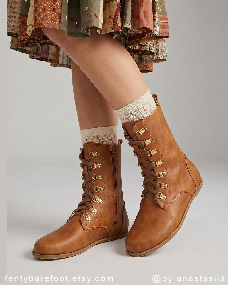 May include: A pair of brown leather lace-up boots with gold-colored eyelets and a side zipper. The boots are worn with cream-colored socks. The Etsy shop name "fentybarefoot.etsy.com" is visible at the bottom of the image.