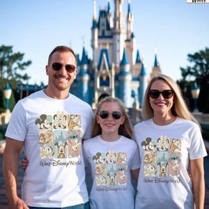 May include: A white t-shirt featuring a grid of Disney character illustrations including Mickey Mouse, Minnie Mouse, Stitch, Donald Duck, and Goofy, with the text Walt Disney World printed in a script font below the graphic design.