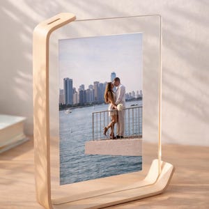 May include: A white ceramic mug with a black handle and the text "But First, Coffee" in a black, bold font. The mug is likely 11-15 ounces in size, perfect for a morning beverage.