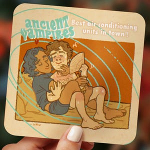 Puede incluir: Posavasos cuadrado con una ilustración de dos figuras abrazándose. El texto dice "ancient vampires" y "Best air-conditioning units in town!!" en un estilo vintage. La paleta de colores incluye beige, naranja y azul.