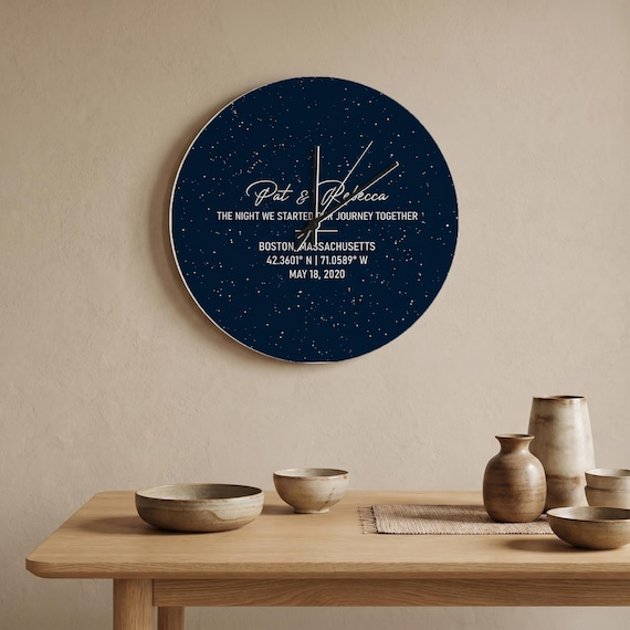 A wooden wall clock that maps the actual star sky above a couple's meaningful location and date — functional art that tells a story no two couples share.