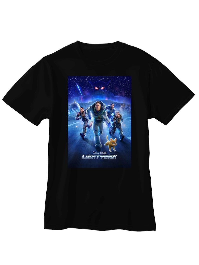 May include: Black t-shirt featuring a graphic from the Disney Pixar movie, Lightyear. The graphic shows Buzz Lightyear and other characters running, with the movie title at the bottom. The background is a space scene with a large, ominous figure.