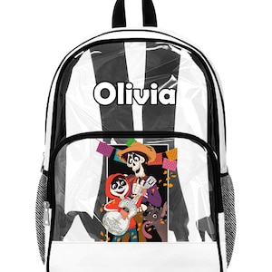 May include: Backpack with a white and black striped design and a clear front pocket. The pocket displays a Coco movie illustration. The name "Olivia" is printed in white on the top of the backpack.