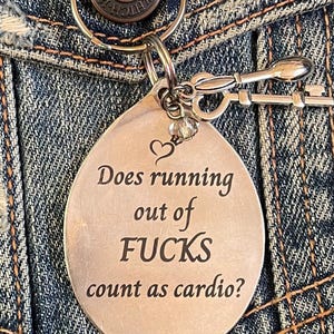 Llavero "Running out Fucks" (Me faltan caras) - hecho con una cuchara antigua bañada en plata.